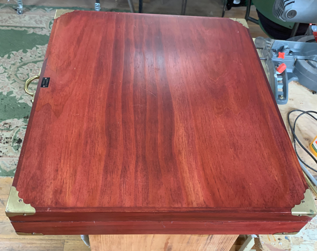 Restored wooden case with brass corner protectors